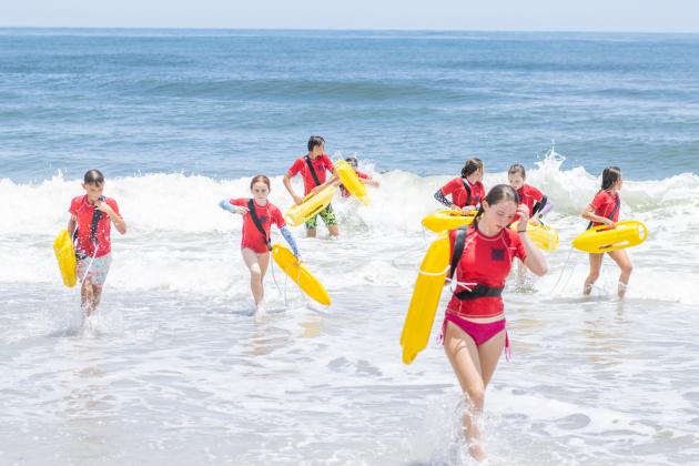 Participants of the Junior Lifeguard Camp take park in an exercise Wednesday at Seaside Park. The first weeklong session of the camp was held this week. Photo by Ashley Chandler/News-Leader