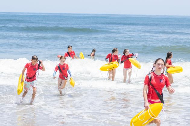 Participants of the Junior Lifeguard Camp take park in an exercise Wednesday at Seaside Park. The first weeklong session of the camp was held this week. Photo by Ashley Chandler/News-Leader