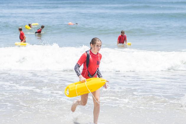 Participants of the Junior Lifeguard Camp take park in an exercise Wednesday at Seaside Park. The first weeklong session of the camp was held this week. Photo by Ashley Chandler/News-Leader