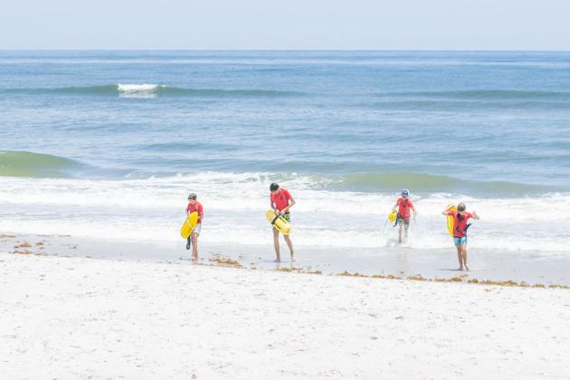 Participants of the Junior Lifeguard Camp take park in an exercise Wednesday at Seaside Park. The first weeklong session of the camp was held this week. Photo by Ashley Chandler/News-Leader