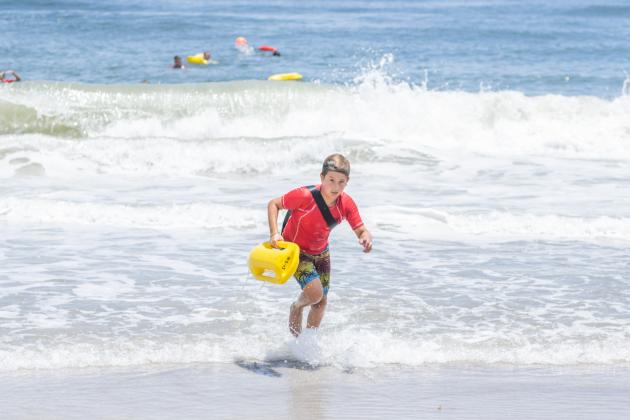 Participants of the Junior Lifeguard Camp take park in an exercise Wednesday at Seaside Park. The first weeklong session of the camp was held this week. Photo by Ashley Chandler/News-Leader