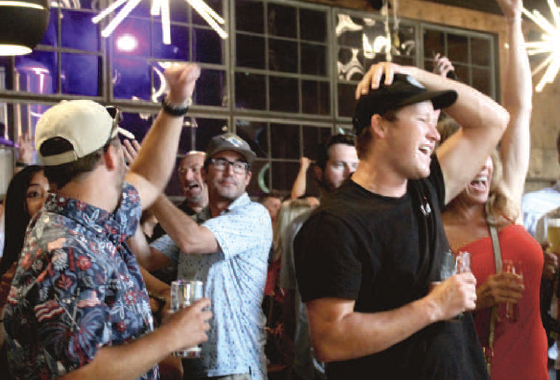 Fans celebrate a U.S. goal on Friday while watching the US Men’s National Team play Australia in a World Cup group stage match. 