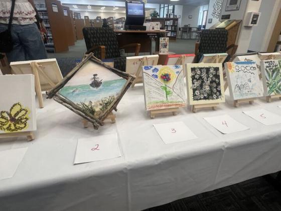 The Friends of the Library is hosting its Tiny Art! Big Fun! Art Contest, featuring more than 40 miniature works created by local artists. The exhibition is currently on display at the library and invites visitors to vote for their favorite pieces through June 26. Photo by Amy Mulligan/News-Leader