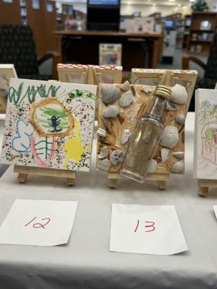 The Friends of the Library is hosting its Tiny Art! Big Fun! Art Contest, featuring more than 40 miniature works created by local artists. The exhibition is currently on display at the library and invites visitors to vote for their favorite pieces through June 26. Photo by Amy Mulligan/News-Leader
