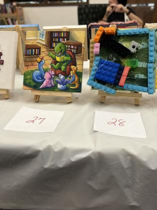 The Friends of the Library is hosting its Tiny Art! Big Fun! Art Contest, featuring more than 40 miniature works created by local artists. The exhibition is currently on display at the library and invites visitors to vote for their favorite pieces through June 26. Photo by Amy Mulligan/News-Leader