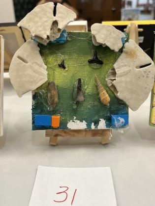 The Friends of the Library is hosting its Tiny Art! Big Fun! Art Contest, featuring more than 40 miniature works created by local artists. The exhibition is currently on display at the library and invites visitors to vote for their favorite pieces through June 26. Photo by Amy Mulligan/News-Leader