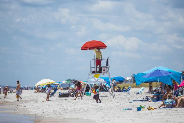  Lifeguards monitor Main Beach on Tuesday to keep people safe. Photo by Ashley Chandler/News-Leader
