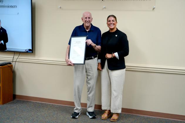 Dr. Alan Miller accepts a Proclamation on behalf of Dr. Kirkwood Adams, Jr., recognizing Dr. Adams contributions to heart failure care, medical research and professional education. Submitted photo