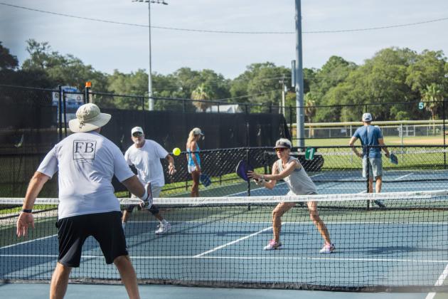 Pickleball players compete at the Fernandina Beach Central Park pickleball courts on Tuesday. Photo by Ashley Chandler/News-Leader