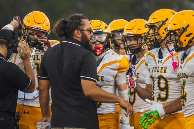 YHS Athletic Director and Head Coach Kyle Dougherty talks to Hornets players during a preseason game Aug. 14. Photo by Ashley Chandler/News-Leader