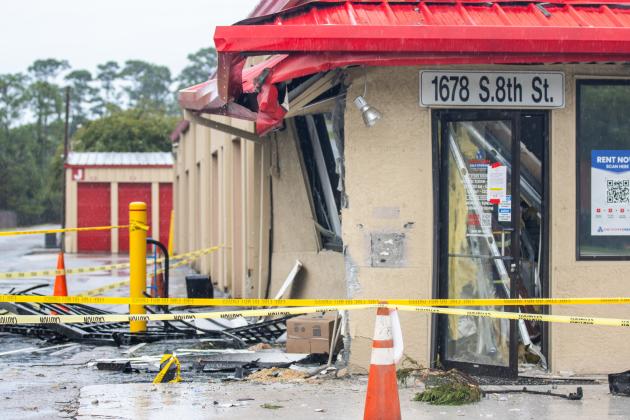 Debris is rained on Thursday afternoon at Devon Self Storage after a vehicle smashed into the building. Photo by Ashley Chandler/News-Leader