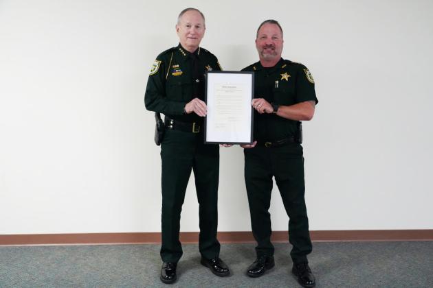 From left, Nassau County Sheriff Bill Leeper  and Undersheriff Jon Hooper pose with a proclamation Monday recognizing the Nassau County Sheriff’s Office’s 200th anniversary.