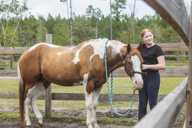Brilee Snyder takes Big Mac out for a ride Monday at Paramount ARC in Yulee. Photo by Ashley Chandler/News-Leader