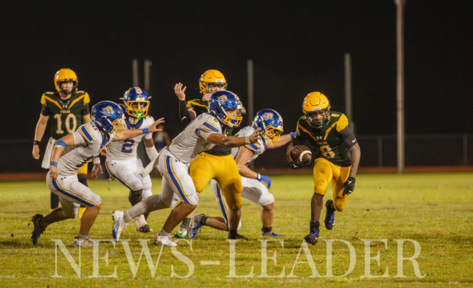 Yulee High School Sophomore Jayden Timmon evades several Pirates on a carry that ended in a touchdown for the Hornets. Photo by Ashley Chandler/News-Leader 