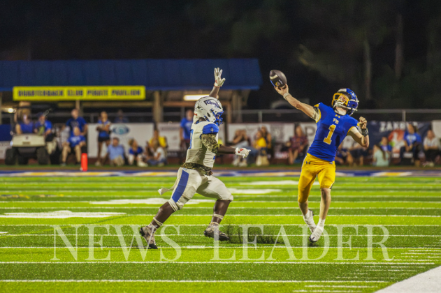 Beckham Rohe throws a pass during the home opener at Fernandina Beach High School’s upgraded stadium. Ashley Chandler/News-Leader