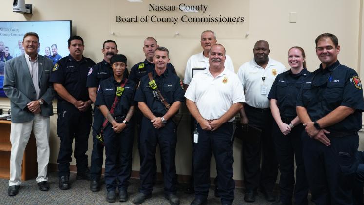 Commissioner Jeff Gray, left, read the proclamation declaring Oct. 4 through 10 as Fire Prevention Safety Week in Nassau County.
