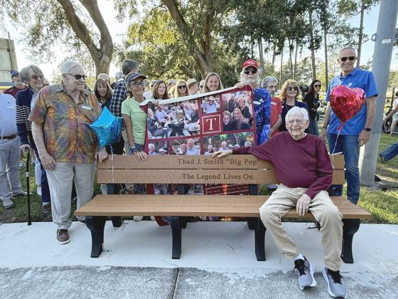 The pickleball community, friends and family honored Thad Smith, front, with a bench near Central Park’s pickleball courts last week. Photo by Nick Blank /News-Leader