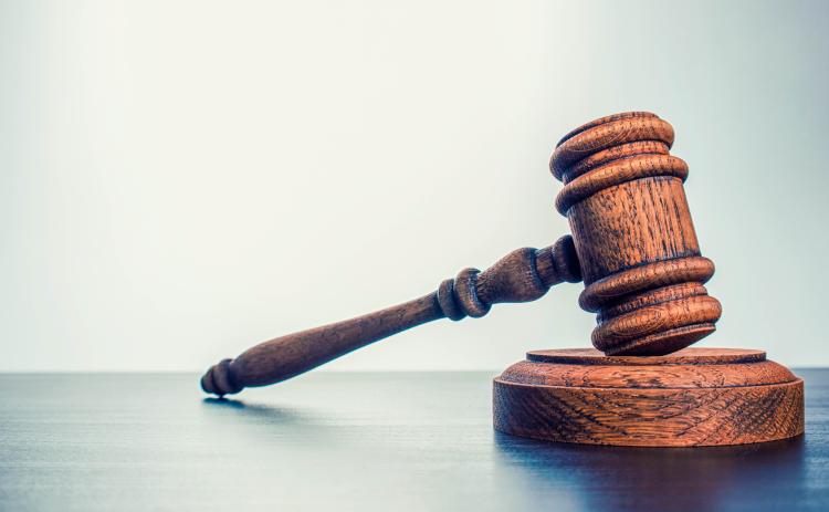 A Jacksonville attorney is suing the Nassau County Clerk of Court's office because it won't accept checks as payment.