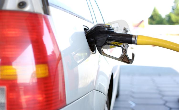 Photo of car refueling gas.