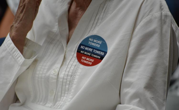 As part of a grassroots operation, stickers and signs were passed out during the May 23 meeting urging commissioners to stand by their ordinance and people. Marissa Mahoney/News-Leader