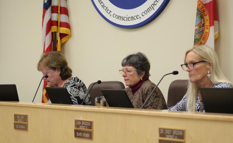 Nassau County School Board chairwoman Donna Martin leads fellow board members Gail Cook and Lissa Braddock through the bid proposals. Photo by Holly Dorman