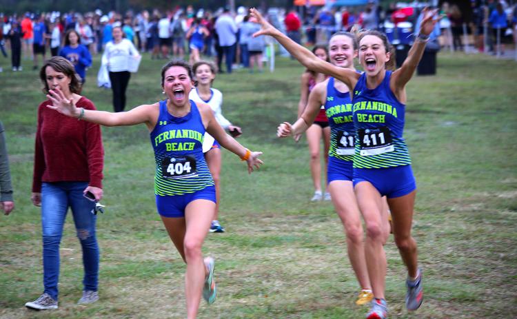 Aislinn Bell, Lauren Quinn and Callie Nesbitt celebrate the Lady Pirates’ eighth-place finish. Photos by Stephanie Nichols/special.