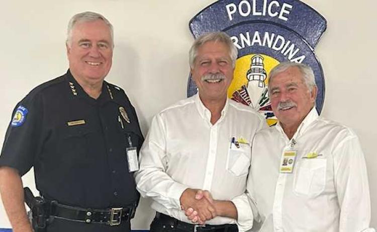 The new chairperson for the Fernandina Police Foundation, retired Fernandina Beach Police Officer Kevin Kozak, is welcomed by, from left, Chief of Police James Hurley, Kozak and Harry Kegler. Submitted photo
