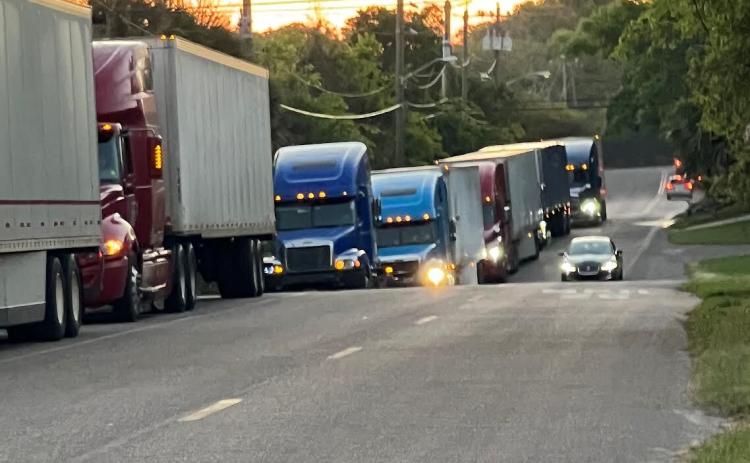 Trucks were backed up on Dade Street last week, causing concern among residents of the neighborhood. Nassau Terminals said it has worked with its customers and hopes the problem has been resolved. Submitted photo