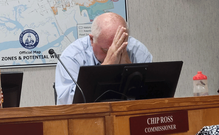 Fernandina Beach City Commissioner Chip Ross listens to fellow commissioners as they discuss the role of a citizens committee and a professional executive search firm in the process of hiring a new city manager. He said any potential hires would be watching the city, and would hesitate coming to Fernandina after seeing the “ludicrous” way it is going about the process. Photo by Julia Roberts/News-Leader