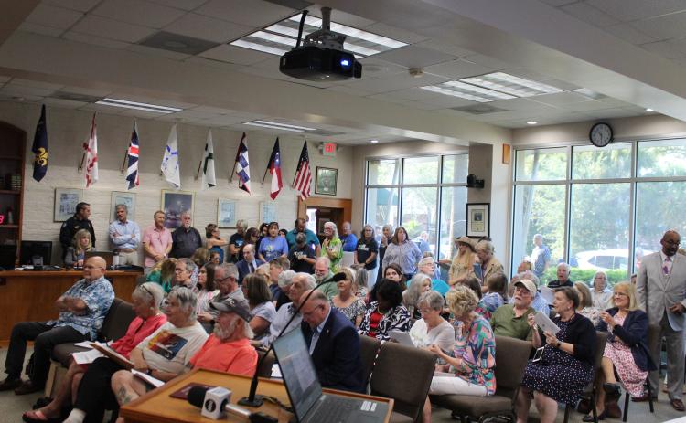 City Hall chambers was filled to overflowing to hear the quasi-judicial hearing regarding development of townhomes on what is known as the Tringali property on Third and Fourth streets in downtown Fernandina Beach. Photo by Julia Roberts/News-Leader