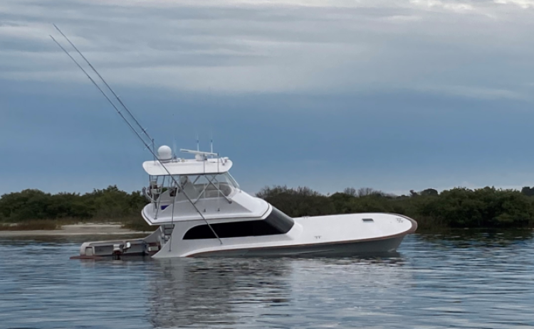 A 54-foot, $1.2 million boat sinks after a collision that killed an endangered North Atlantic right whale calf and severely injured its mother in 2021 near St. Augustine. Photos courtesy Florida Fish and Wildlife Conservation Commission
