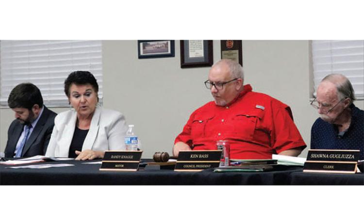 Nassau County School Board Attorney Brett Steger, Superintendent Kathy Burns, Callahan Mayor Randy Knagge and Callahan Town Council President Ken Bass are among those in attendance at a workshop in Callahan Monday night. Photo by Kathie Sciullo/CNI Newspapers