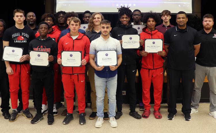 Nassau County Schools Superintendent Kathy Burns congratulates the Hilliard Flashes varsity basketball team during a Nassau County School Board meeting Thursday as part of her “Superintendent Spotlight” segment. Photo by Kathie Sciullo/Community Newspapers