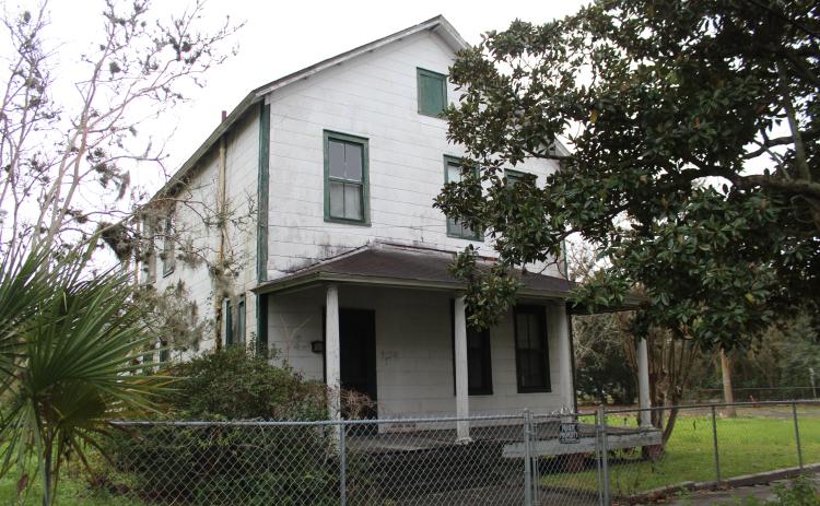 The property, located on Third and Fourth streets, currently has four single-family homes and accessory structures that were built by the Tringali family. Photo by Julia Roberts/News-Leader