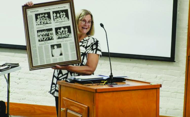 Linda Velardi Trump, the daughter of Joe Velardi, who headed the effort to bring Little League to Fernandina Beach in the 1950s, shares some of the history of the field that is named for her father. She brought a framed story, which ran in the News-Leader in the 1970s, about her father to city hall, and said the field should remain a softball and baseball field. The community, and the city commission, agreed. Submitted photo
