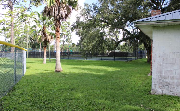 The proposed location of the new lift station is in what Utilities Director Andre Desilet called a “dead space,” a triangular space between the ball field, tennis courts and Boy and Girl Scout facilities and a garden area called Volunteer Grove. Photo by Julia Roberts/News-Leader