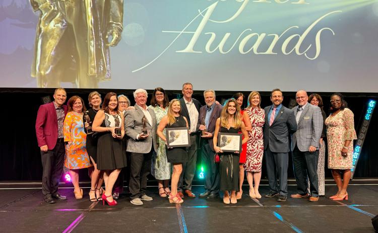 Staff and representatives of the Amelia Island Convention & Visitor's Bureau (CVB), Nassau County and Amelia Island Tourist Development Council pose with the CVB's Flagler Awards at the 2024 Flagler Awards ceremony held at the 2024 Florida Governor’s Conference on Tourism, Aug. 28-30 in Tampa. Submitted photo
