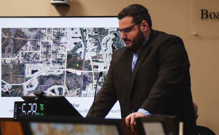 Joshua Macbeth, senior planner/designer in the Nassau County Planning Department presents during a Quasi-Judicial Public Hearing on Monday at the Nassau County Board of County Commissioners meeting. The graphic behind him shows Parcel B. The Final Development Plan approved at the hearing was for Nassau Crossing Planned Unit Development Parcel B. Photos by Ashley Chandler/News-Leader