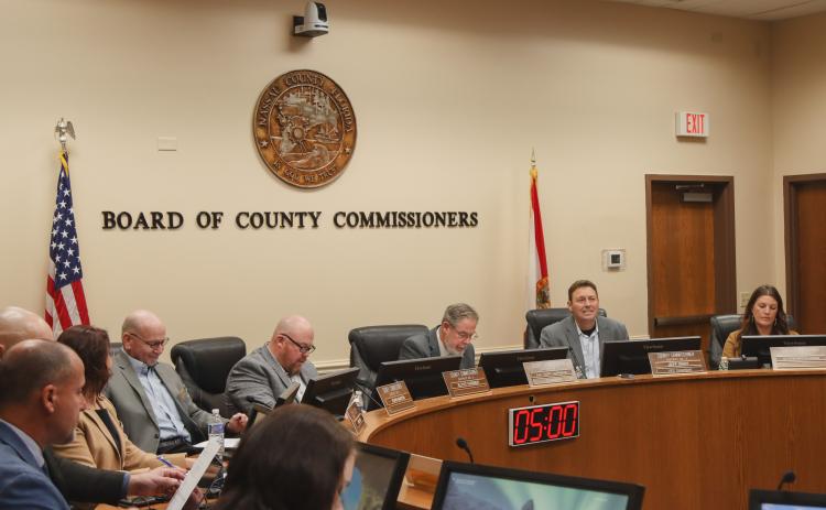 From left, commissioners John Martin, Klynt Farmer, A.M. "Hupp" Huppmann, Jeff Gray and Alyson McCullough work in the Commission Chambers during the Board of County Commissioners regular Wednesday morning meeting. Photo by Ashley Chandler/News-Leader