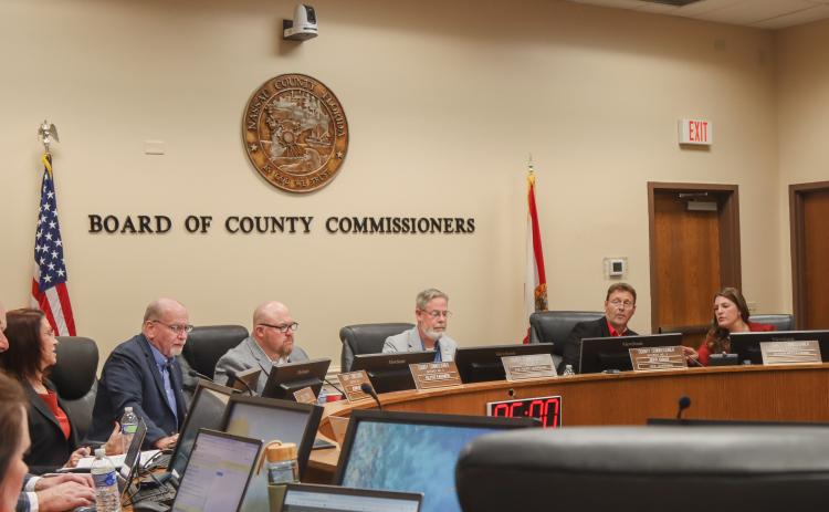 The Board of County Commissioners navigate a new computer program it will be using going forward at meetings. From left: County Attorney Denise May, commissioners John Martin, Klynt Farmer, A.M. “Hupp” Huppmann, Jeff Gray and Alyson McCullough. Photo by Ashley Chandler/News-Leader
