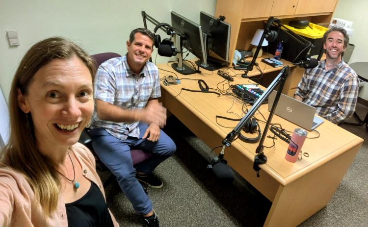 From left, Alyssa Vinson, UF/IFAS Hillsborough County extension agent, Dr. Hector Pérez and Taylor Clem, Nassau County extension agent, pose for a photo together in a traveling studio the duo set up at the state Florida-Friendly Landscaping office in Gainesville to record an episode of Cultivating Curiosity. Vinson and Clem, cohosts, interviewed Pérez for the first episode of 2025, titled A Couple of Seed Geeks. Submitted photo