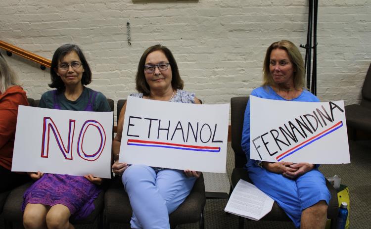 No Ethanol Fernandina group photo Elsa Liebenberg, Sandra Carey and Bryn Byron began protesting a bioethanol plant proposed for RYAM’s Fernandina Beach campus last year. This week, Fernandina Beach City Manager Sarah Campbell ruled the plant cannot be allowed under the city’s Land Development Code and Comprehensive Plan. RYAM has 30 days to appeal that decision. Photo by Julia Roberts/News-Leader