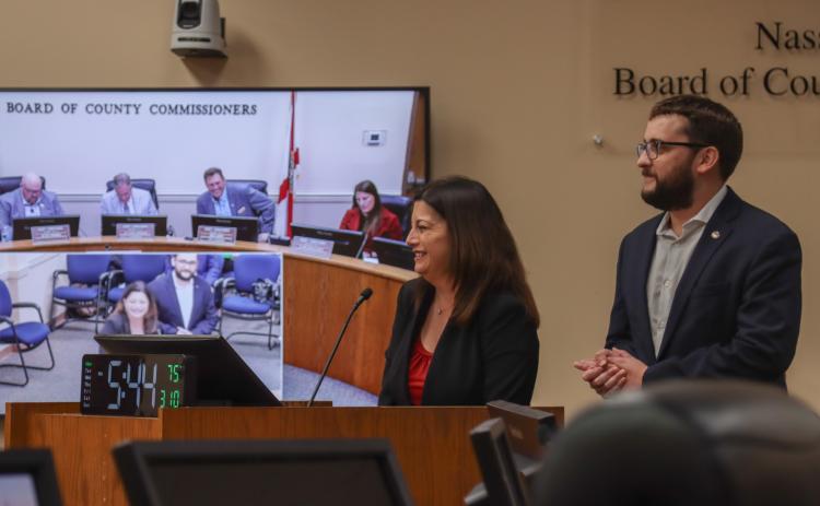 From left, Christina Thomas and Austin Nicklas of the Northeast Florida Builder’s Association, at the March 10 Board of County Commissioners meeting. The board signed a Letter of Support for a state appropriations request that will be used to expand the apprenticeship program. Photo by Ashley Chandler/News-Leader