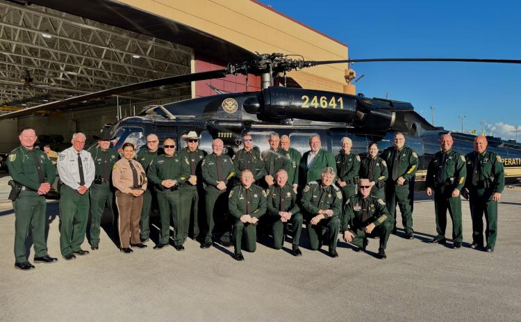 Nassau County Sheriff Bill Leeper, bottom row second from the left, joined other state law enforcement in Miami-Dade County last week for a press conference about the 287 (g) program. All 67 Florida counties have entered into agreement with ICE to assist in serving warrants for those in the United States illegally. Submitted photo