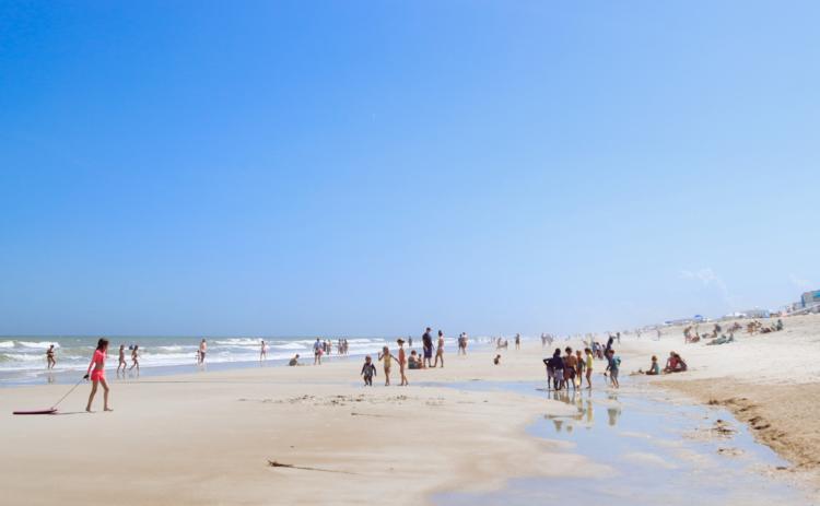 Visitors of Main Beach enjoy the warming weather in April. Photo by Ashley Chandler/News-Leader