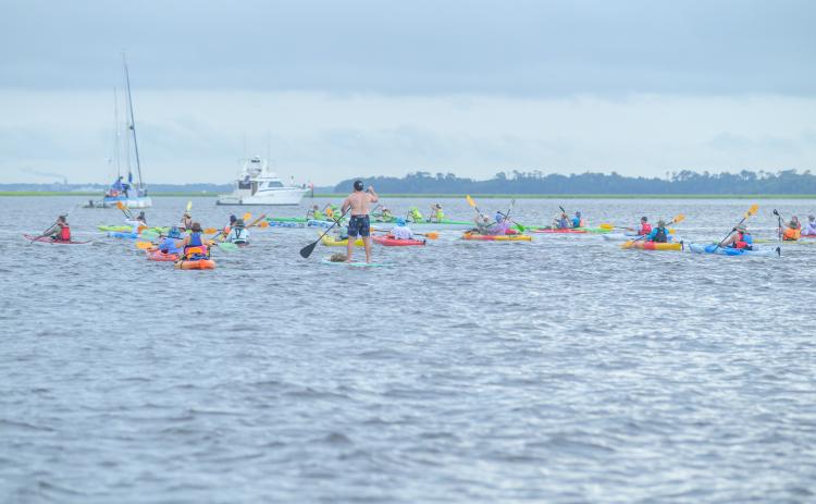Paddlers take part in the 2024 Cross the Line Paddle for Veterans event. The annual event is set for June 21. File photo