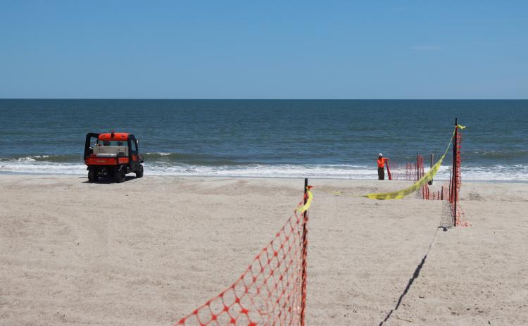 Beach renourishment at Main Beach on May 22. Photo by Ashley Chandler/News-Leader