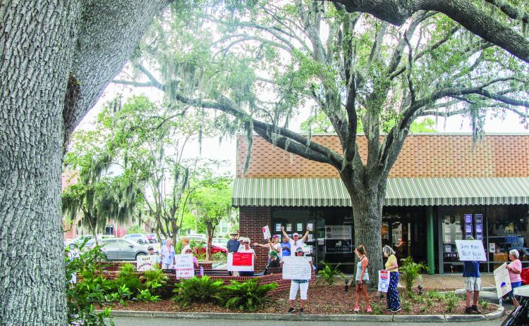 Unified Nassau Florida, a nonpartisan political group in its infancy rooted in progressive values held a protest July 7 outside Congressman Aaron Bean’s local office. Photo by Ashley Chandler/News-Leader