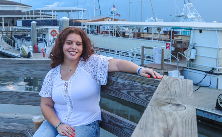 Quinn Ortiz at the Downtown Harbor Marina on Aug. 17. Quinn holds the title of 'Miss Nassau' after placing in the Top 25 at Florida's state competition with National American Miss. She is heading for nationals, set for the week of Thanksgiving. The Yulee native said she spends a lot of time in downtown Fernandina Beach with her friends. Photo by Ashley Chandler/News-Leader