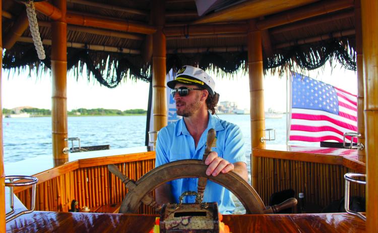 Owner and captain Ryan Ian Spinella during the sunset cruise last Monday Aug. 11. By Marisa DeMar/News-Leader